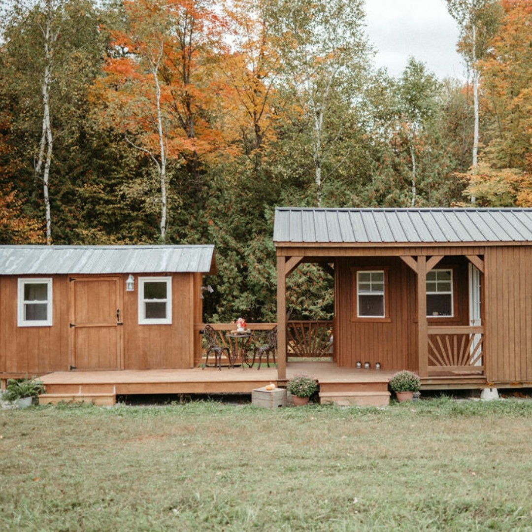 Photo shows a quaint brown cabin in the bush at The Roost Farm, part of the Maple Magic Weekend farm stay experience.