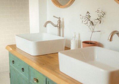 The Loft at The Roost Farm & Market: double vanity with round mirrors