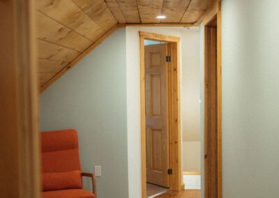 The Loft at The Roost Farm & Market: hallway nook with armchair